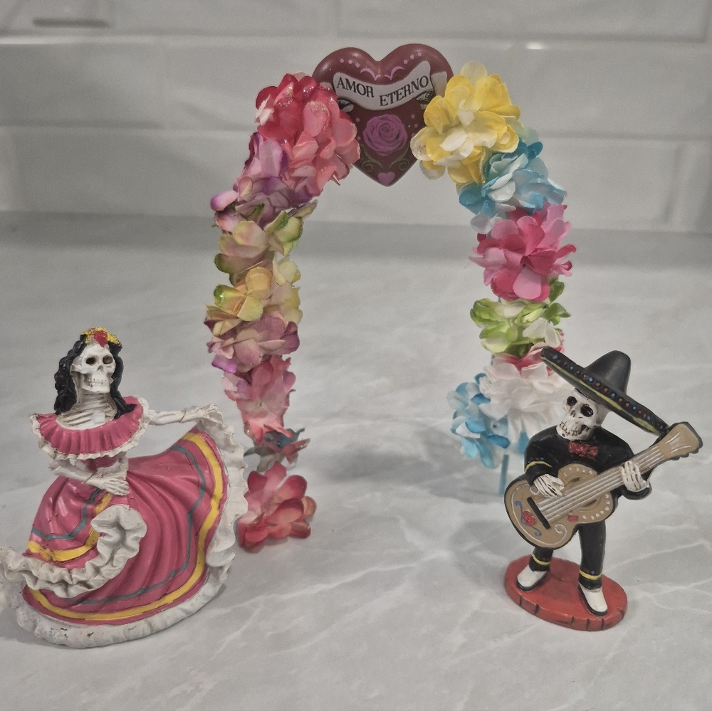 Festive Skeleton Couple with Floral Arch